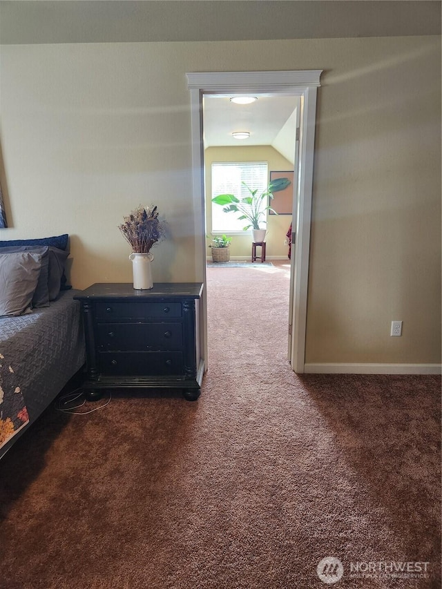 9244 Carys St SE, Yelm, WA 98597 - bedroom with vaulted ceiling, dark colored carpet, and baseboards