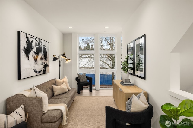 living room featuring light wood-style flooring and recessed lighting