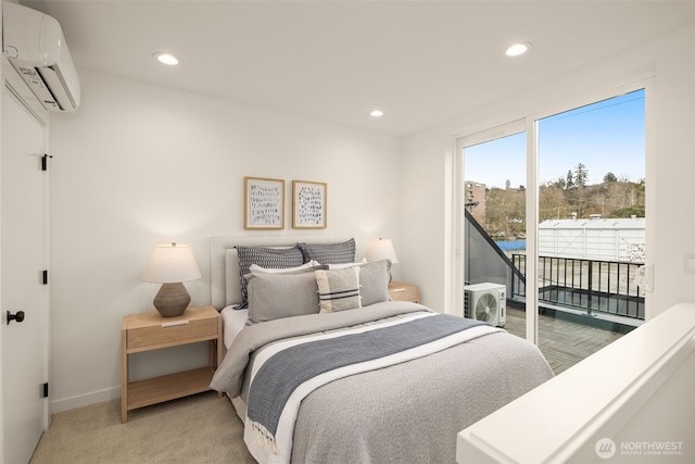 bedroom with access to outside, light colored carpet, recessed lighting, an AC wall unit, and baseboards