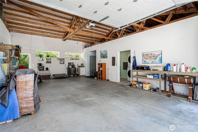 876 1st St, Chelan Falls, WA 98817 - garage featuring a garage door opener and electric panel