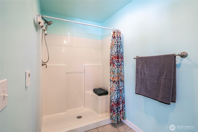 876 1st St, Chelan Falls, WA 98817 - bathroom with tile patterned flooring, a shower with curtain, and baseboards
