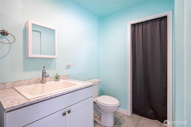 876 1st St, Chelan Falls, WA 98817 - full bath featuring vanity, toilet, tile patterned flooring, and curtained shower
