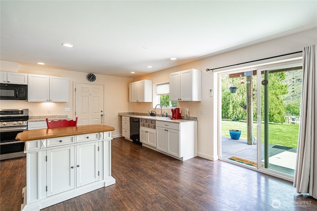 876 1st St, Chelan Falls, WA 98817 - kitchen featuring black appliances, wood counters, white cabinets, dark wood-type flooring, and baseboards