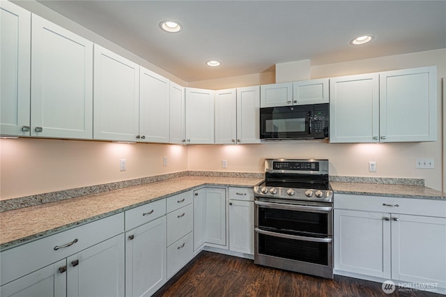 876 1st St, Chelan Falls, WA 98817 - kitchen featuring black microwave, double oven range, light countertops, dark wood finished floors, and recessed lighting