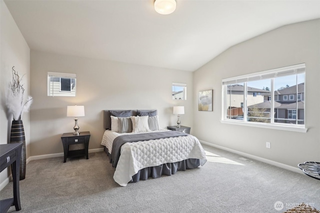 carpeted bedroom featuring visible vents, baseboards, and lofted ceiling