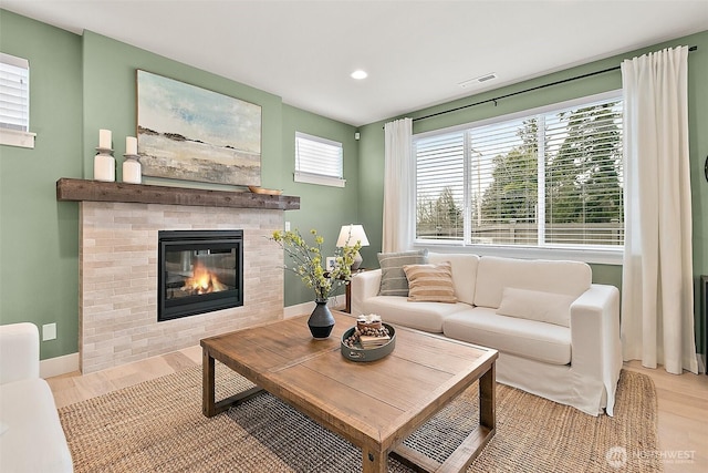 14232 SE 284th Pl, Kent, WA 98042 - living room with wood finished floors, a glass covered fireplace, baseboards, visible vents, and recessed lighting