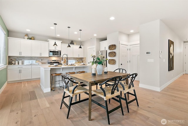 14232 SE 284th Pl, Kent, WA 98042 - dining area with light wood-style flooring, baseboards, and recessed lighting
