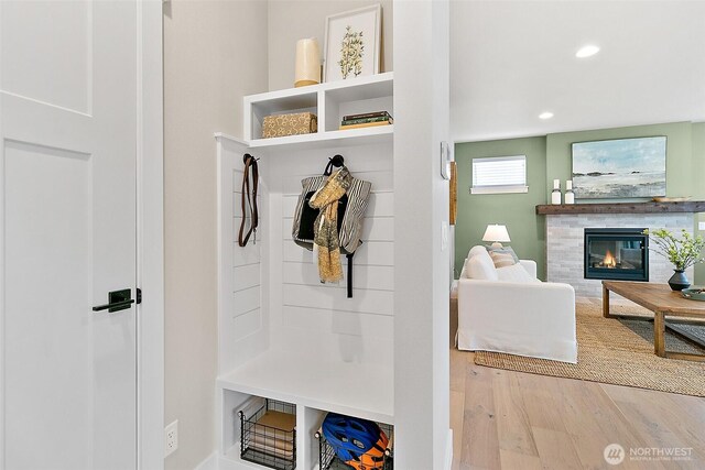 14232 SE 284th Pl, Kent, WA 98042 - mudroom featuring a fireplace, wood finished floors, and recessed lighting
