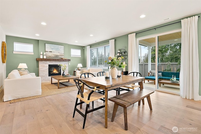 14232 SE 284th Pl, Kent, WA 98042 - dining space with recessed lighting, light wood-type flooring, visible vents, and a tiled fireplace