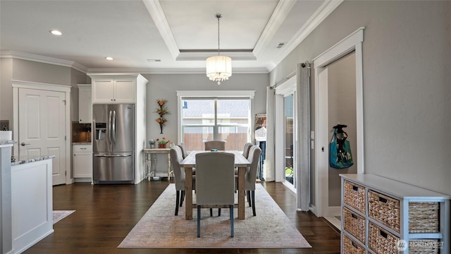 131 NW Blalock Dr, College Place, WA 99324 - dining space featuring a chandelier, crown molding, and dark wood finished floors