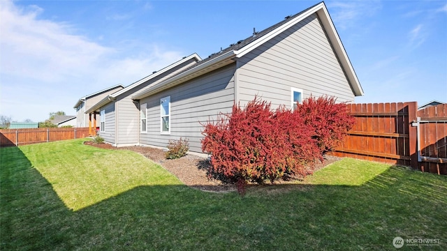 131 NW Blalock Dr, College Place, WA 99324 - view of property exterior featuring a yard and fence