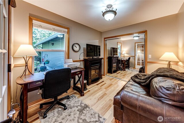 home office featuring light wood-style floors