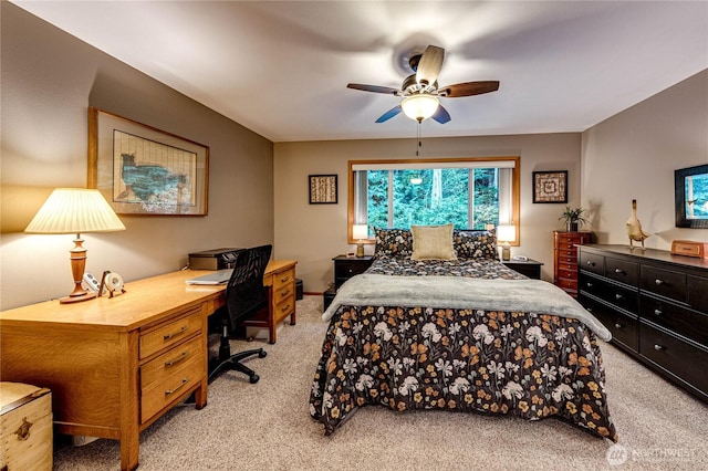 bedroom with light colored carpet and a ceiling fan