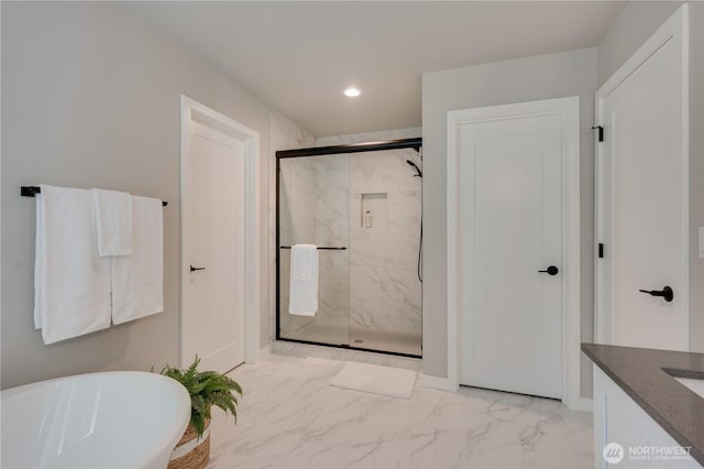 full bath with a soaking tub, a marble finish shower, recessed lighting, marble finish floor, and vanity