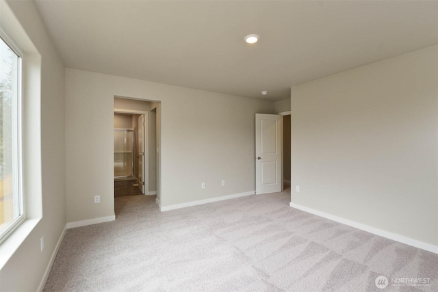 2306 158th Street Ct E, Tacoma, WA 98445 - unfurnished bedroom featuring ensuite bath, baseboards, and light colored carpet