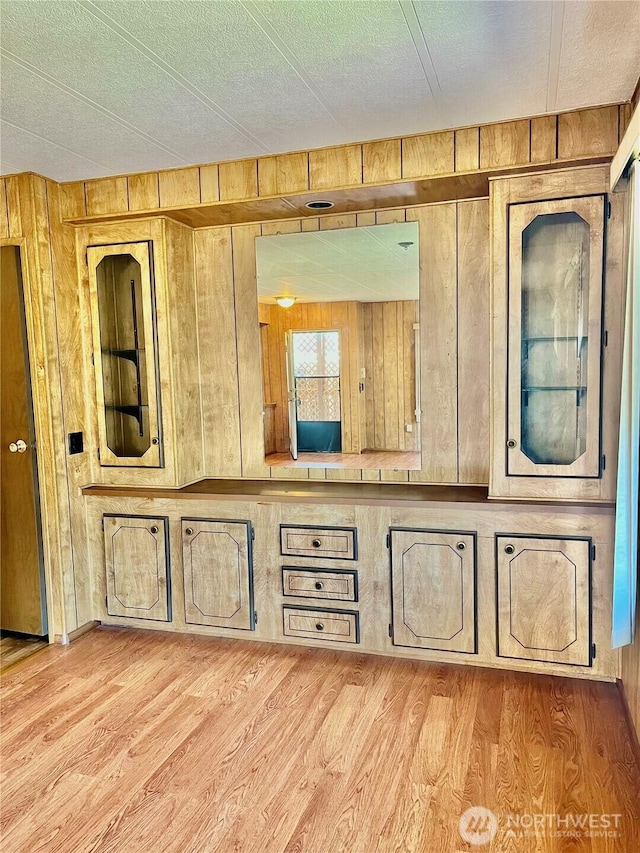 815 124th St SW Unit 144, Everett, WA 98204 - bathroom with wood finished floors, a textured ceiling, and wood walls
