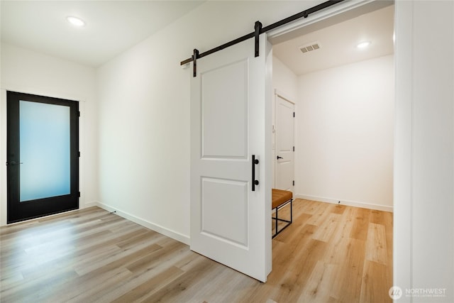 709 E 5th St, Nooksack, WA 98276 - interior space featuring recessed lighting, baseboards, light wood-type flooring, and a barn door