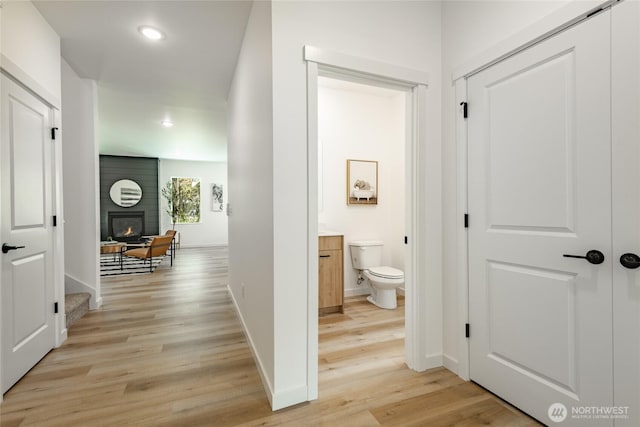 709 E 5th St, Nooksack, WA 98276 - hallway featuring recessed lighting, baseboards, and light wood-style flooring