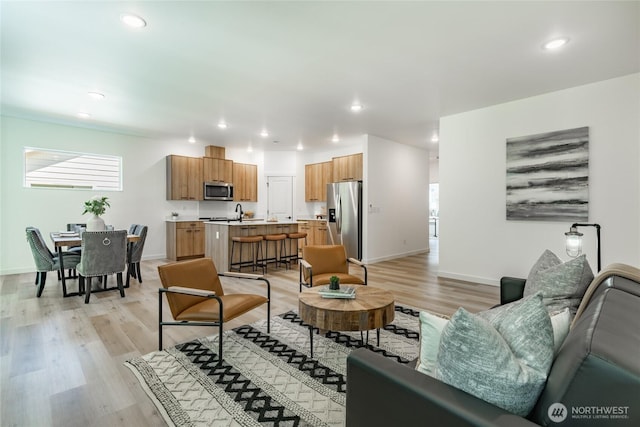 709 E 5th St, Nooksack, WA 98276 - living room featuring recessed lighting, baseboards, and light wood-type flooring