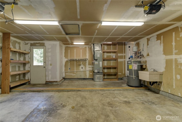 5350 Aspinwall Ct NW, Olympia, WA 98502 - garage with a garage door opener, a sink, strapped water heater, and heating unit