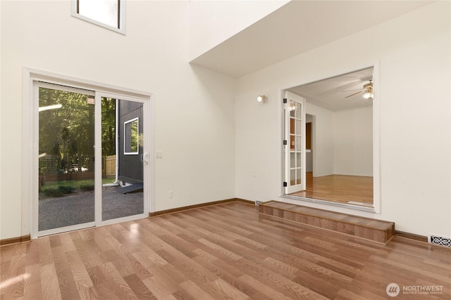 5350 Aspinwall Ct NW, Olympia, WA 98502 - spare room with wood finished floors, ceiling fan, and baseboards