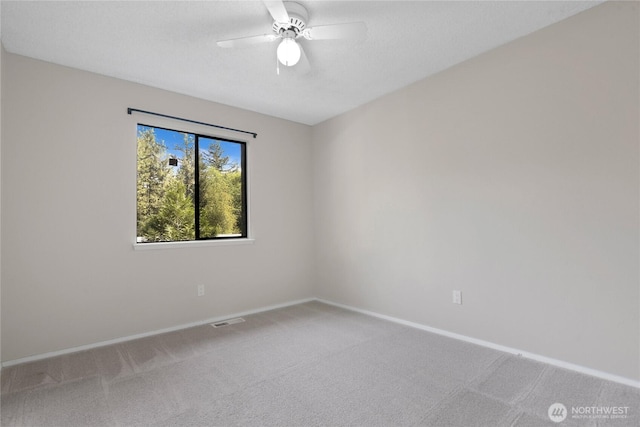 5350 Aspinwall Ct NW, Olympia, WA 98502 - unfurnished room with carpet floors, baseboards, and ceiling fan