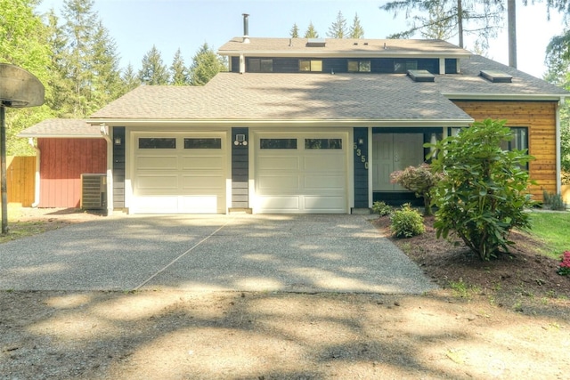 5350 Aspinwall Ct NW, Olympia, WA 98502 - single story home featuring a garage, asphalt driveway, central AC unit, and roof with shingles