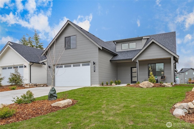 710 E 5th St, Nooksack, WA 98276 - view of front of home featuring roof with shingles, an attached garage, concrete driveway, and a front yard