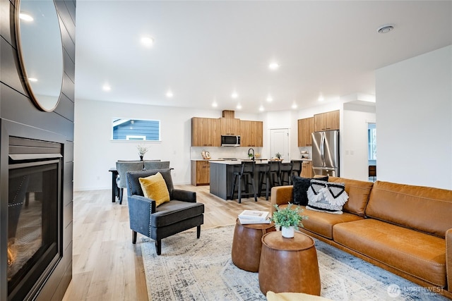 710 E 5th St, Nooksack, WA 98276 - living area featuring recessed lighting, light wood finished floors, and a fireplace