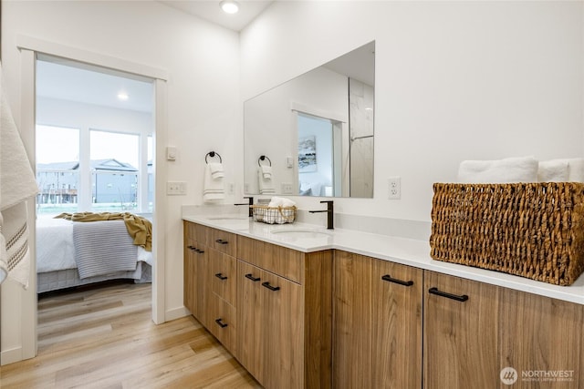710 E 5th St, Nooksack, WA 98276 - ensuite bathroom with wood finished floors, a sink, ensuite bath, and double vanity