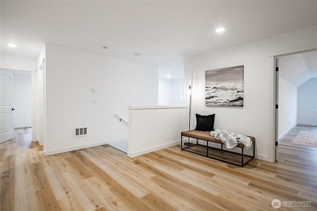 710 E 5th St, Nooksack, WA 98276 - hallway with visible vents, wood finished floors, baseboards, recessed lighting, and an upstairs landing
