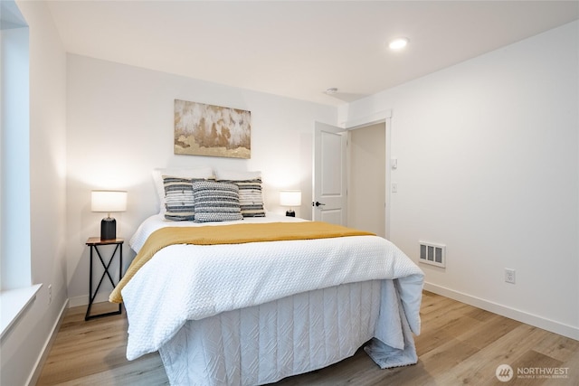 710 E 5th St, Nooksack, WA 98276 - bedroom featuring baseboards, wood finished floors, and visible vents