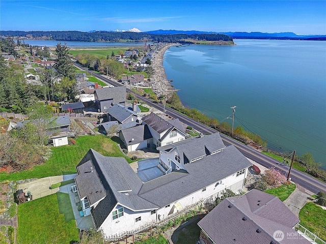 birds eye view of property featuring a water and mountain view and a residential view