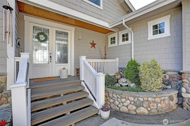 property entrance with french doors and covered porch