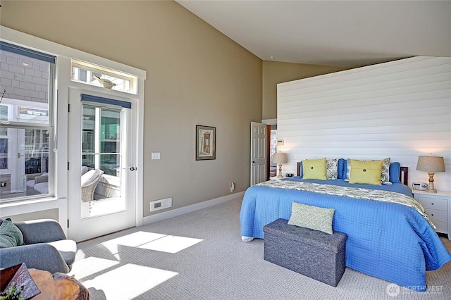 carpeted bedroom with visible vents, access to outside, and high vaulted ceiling