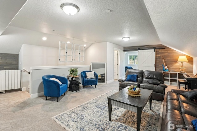 carpeted living room with lofted ceiling, wooden walls, a textured ceiling, and radiator