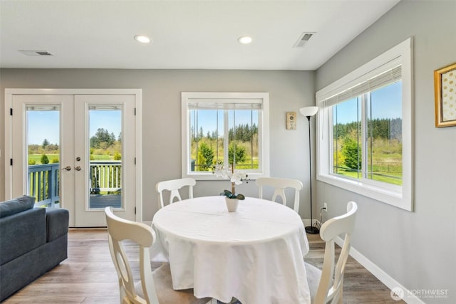 dining room featuring french doors, visible vents, baseboards, recessed lighting, and wood finished floors