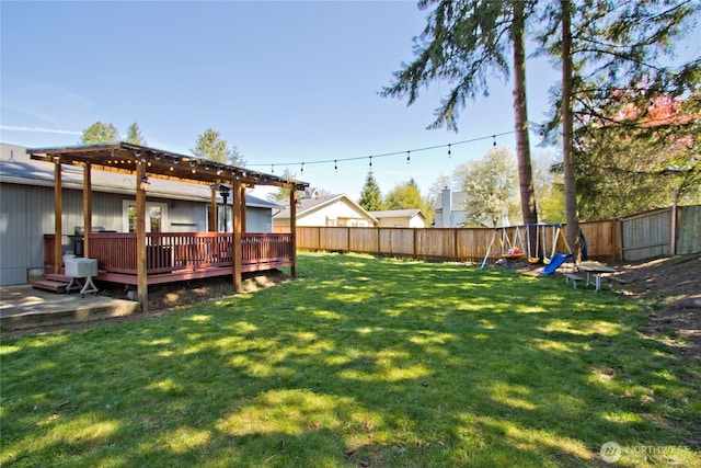 21221 SE 271st Pl, Maple Valley, WA 98038 - view of yard with a fenced backyard, a wooden deck, and a pergola