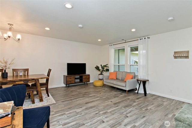21221 SE 271st Pl, Maple Valley, WA 98038 - living area featuring light wood-style flooring, a notable chandelier, and recessed lighting