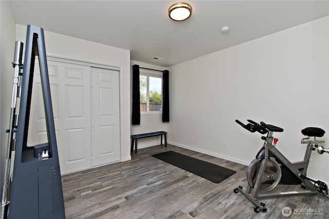 21221 SE 271st Pl, Maple Valley, WA 98038 - workout room with visible vents, baseboards, and wood finished floors