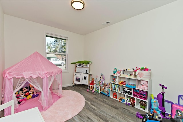 21221 SE 271st Pl, Maple Valley, WA 98038 - rec room with visible vents, baseboards, and wood finished floors