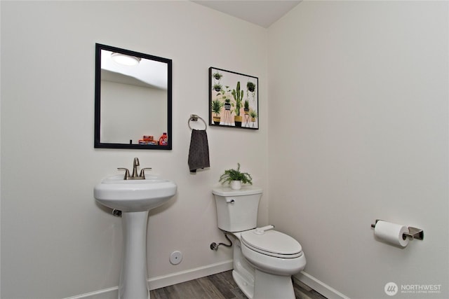 21221 SE 271st Pl, Maple Valley, WA 98038 - bathroom featuring toilet, baseboards, wood finished floors, and a sink