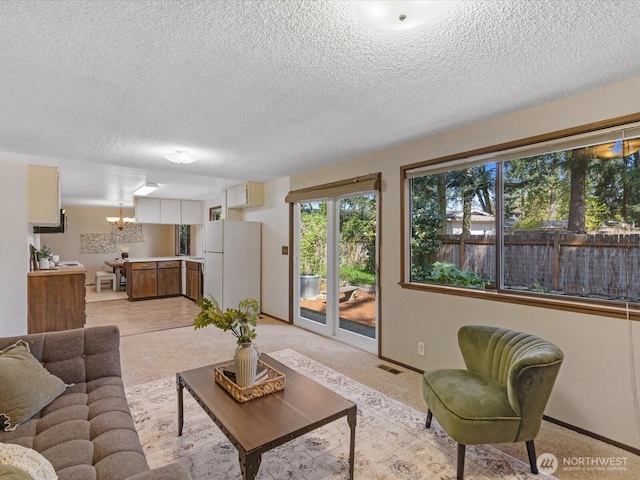 8142 NE 145th Pl, Kenmore, WA 98028 - living area featuring a textured ceiling, baseboards, and visible vents