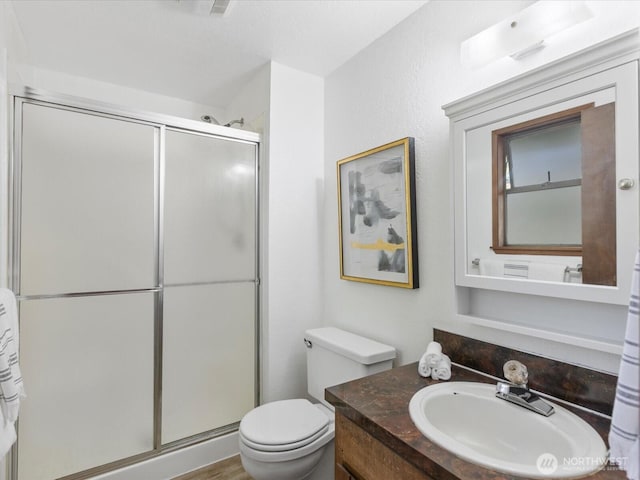 8142 NE 145th Pl, Kenmore, WA 98028 - bathroom featuring vanity, a shower stall, and toilet