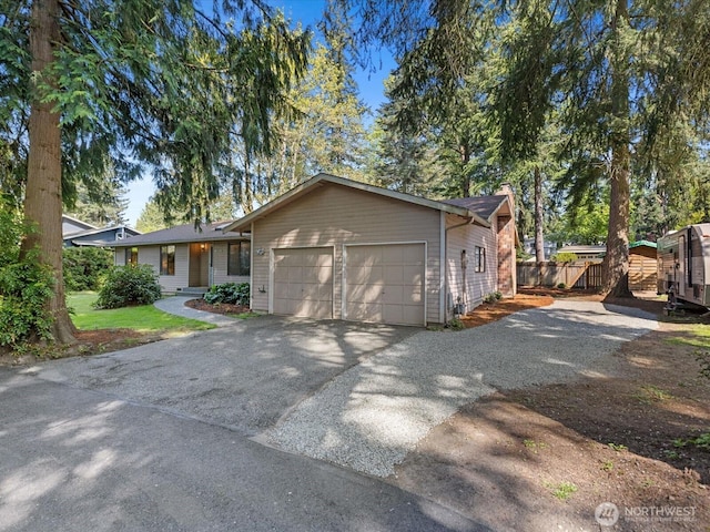 8142 NE 145th Pl, Kenmore, WA 98028 - ranch-style home featuring an attached garage, a chimney, aphalt driveway, and fence
