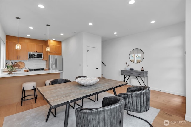 431 19th Ave E, Seattle, WA 98112 - dining room with light wood-style flooring, recessed lighting, and baseboards