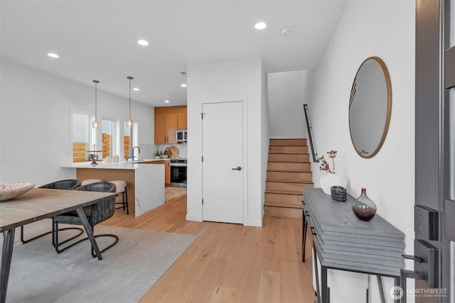 431 19th Ave E, Seattle, WA 98112 - home office featuring light wood-style floors, a sink, and recessed lighting