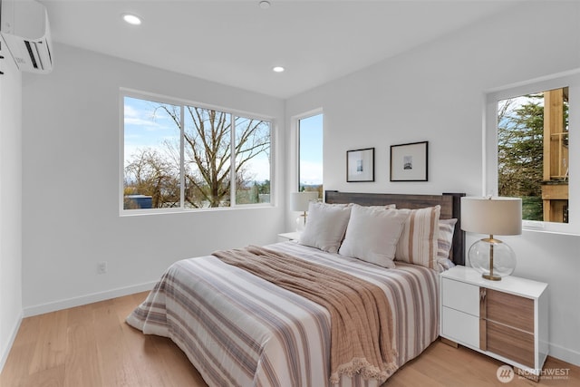 431 19th Ave E, Seattle, WA 98112 - bedroom featuring an AC wall unit, light wood-type flooring, baseboards, and recessed lighting