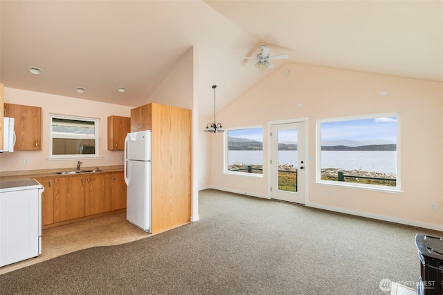 840 Beckett Point Rd, Port Townsend, WA 98368 - kitchen with light carpet, freestanding refrigerator, ceiling fan, electric stove, and a sink