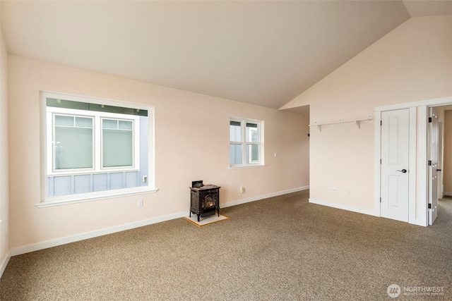 840 Beckett Point Rd, Port Townsend, WA 98368 - interior space featuring high vaulted ceiling, a wood stove, and baseboards